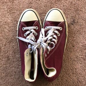 Maroon Converse high-tops.